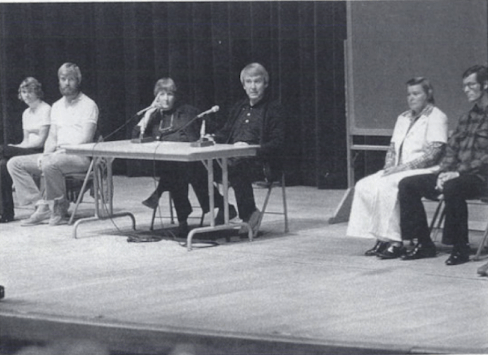 'The Two' (center) and some members in a meeting.