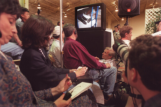 The press and police review the images from inside the Rancho Santa Fe mansion